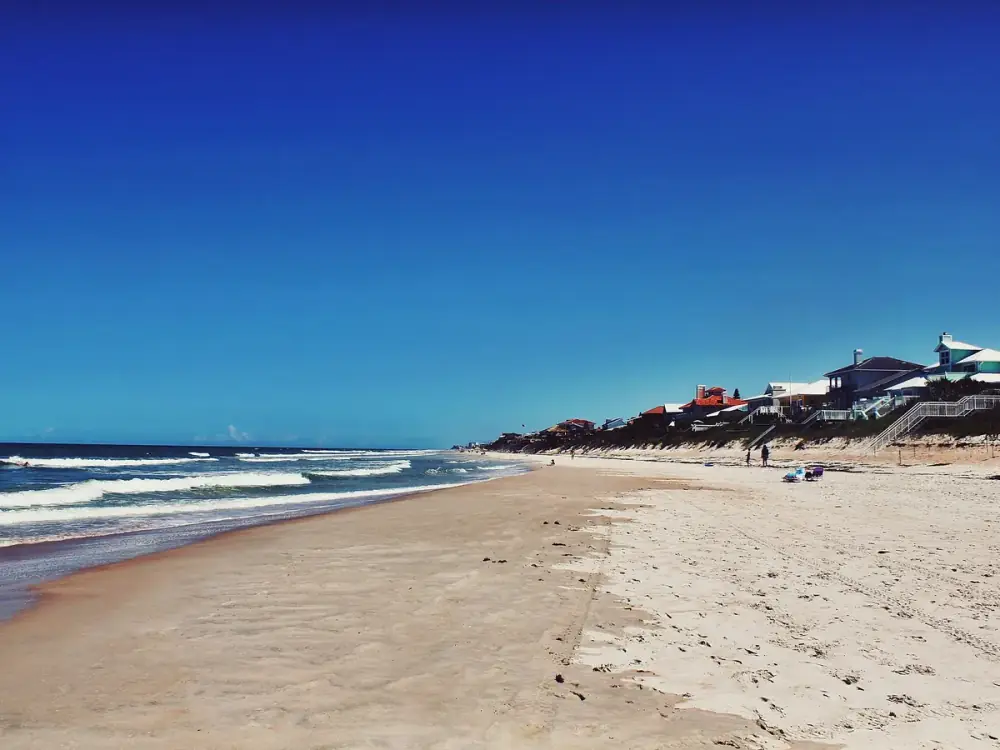 The sandy shoreline and ocean at New Smyrna Beach